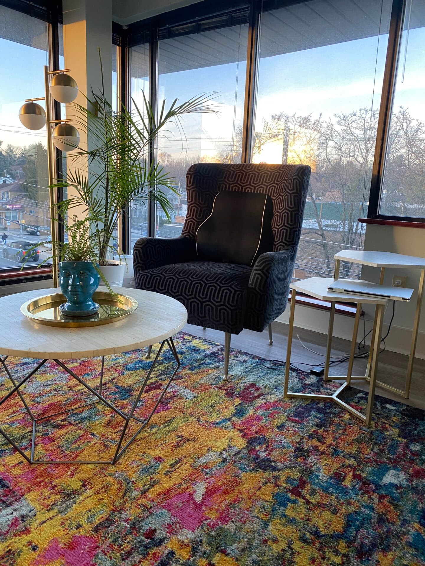 Therapy office with colorful rug and city view